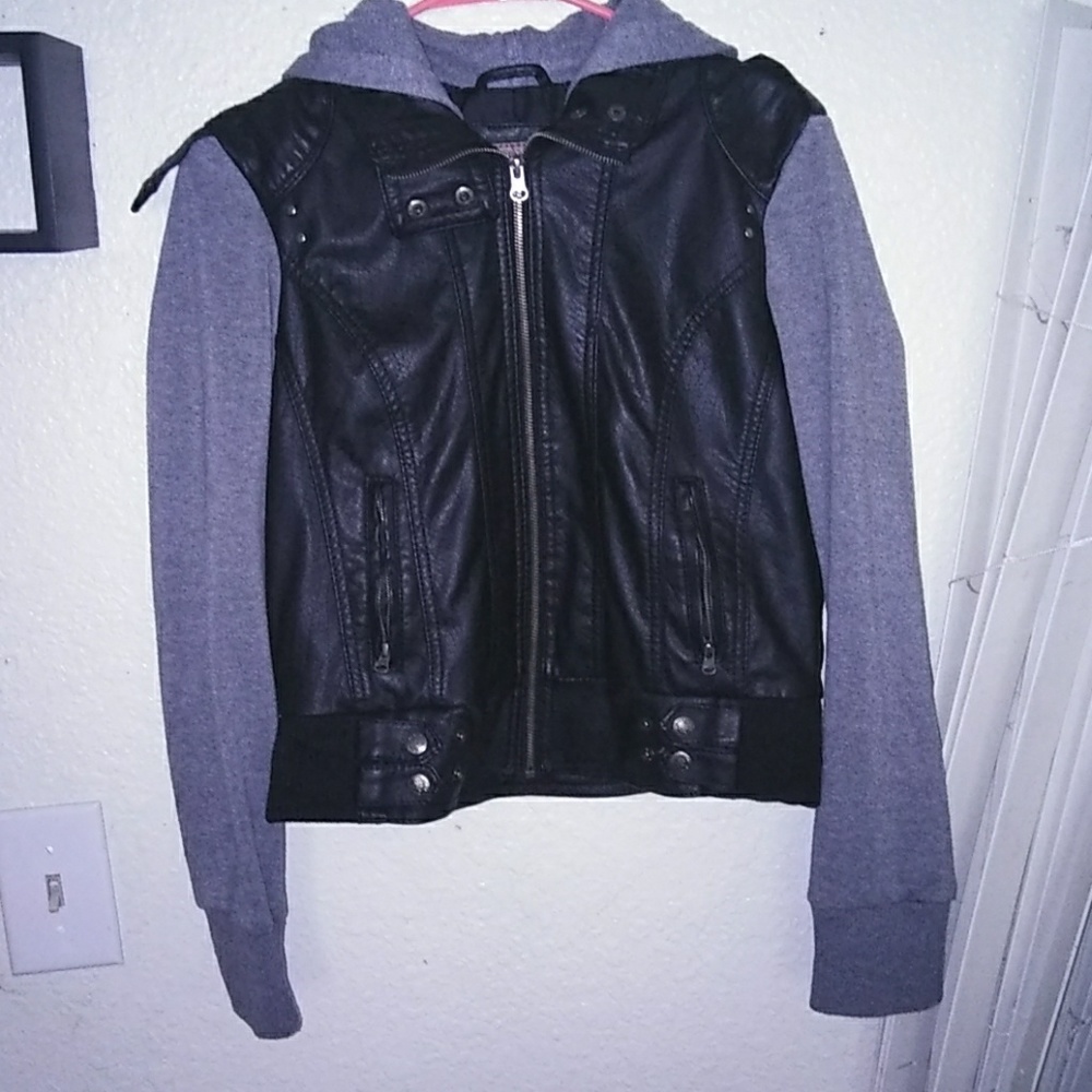 Leather jacket with material sleeves